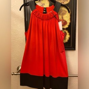 Calvin Klein top with black pleather neckline. Size Large. NWT. Tango red